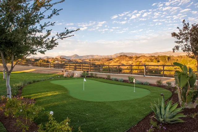 a view of a lake with a yard