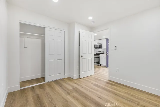 a view of a livingroom with wooden floor