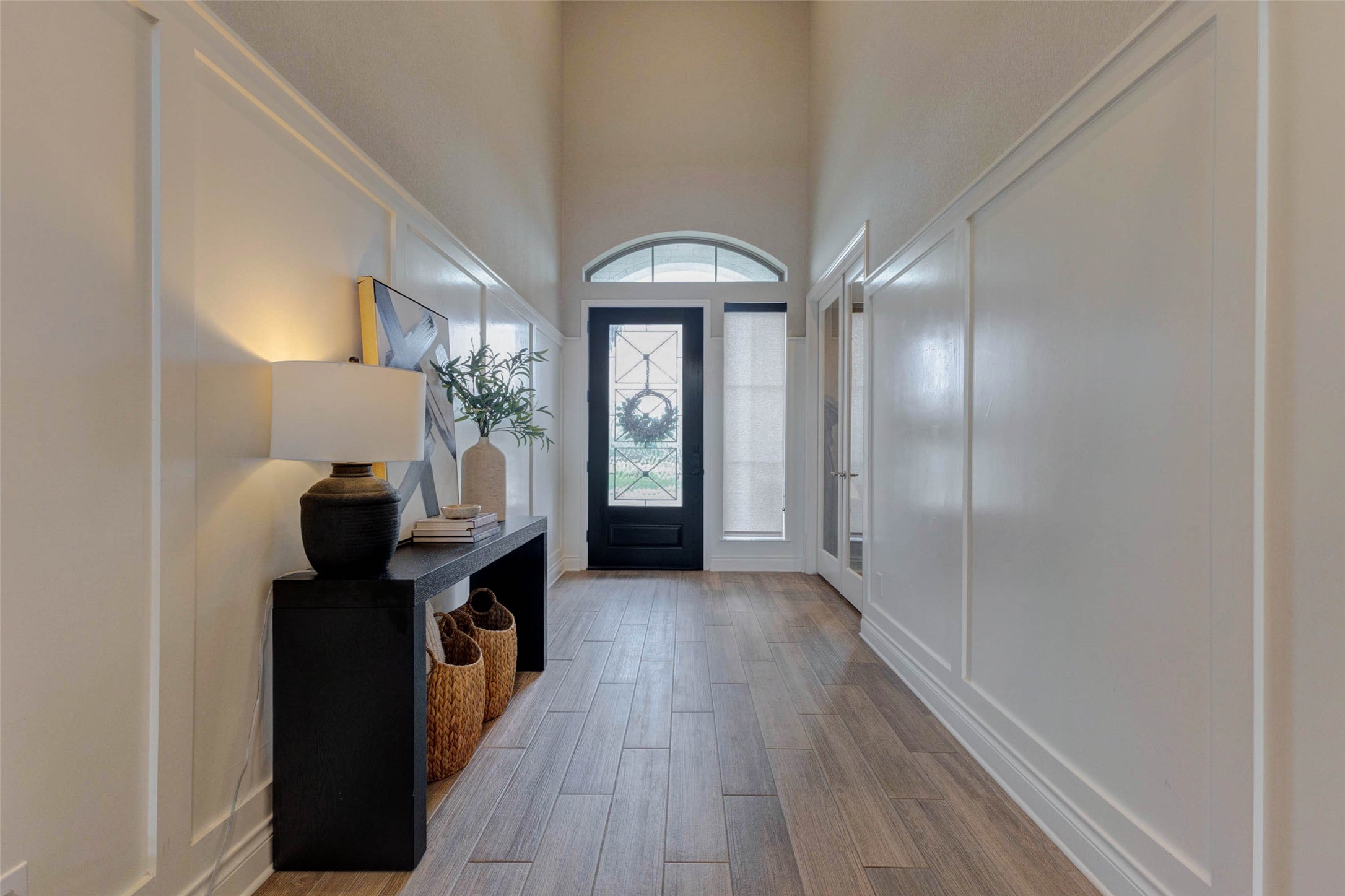 4303 Tupelo Leaf Court Manvel, TX 77578 - Photo 6 of 50 a view of a hallway view with wooden floor and staircase