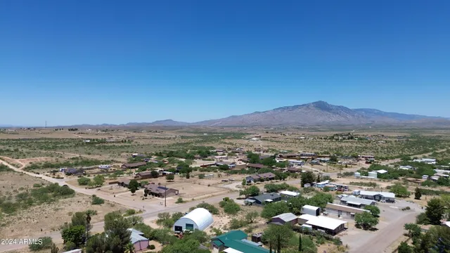 an aerial view of residential house and green space