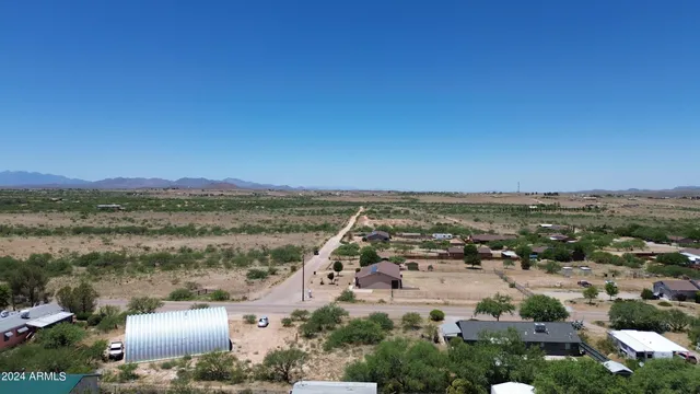 an aerial view of residential house and green space