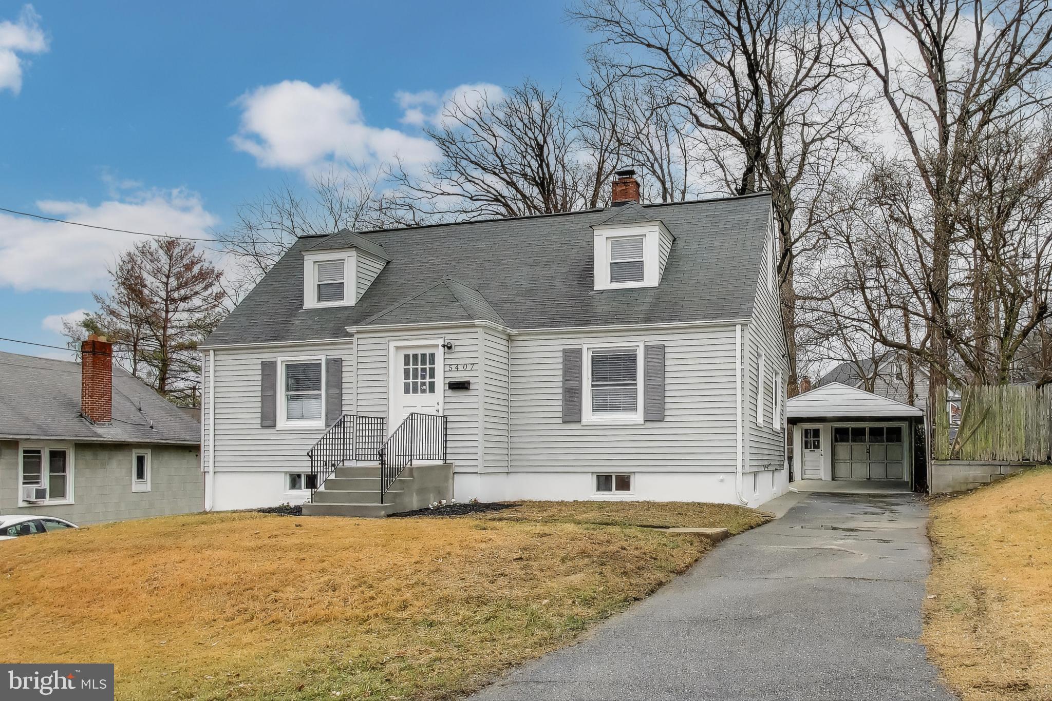 a front view of a house with yard