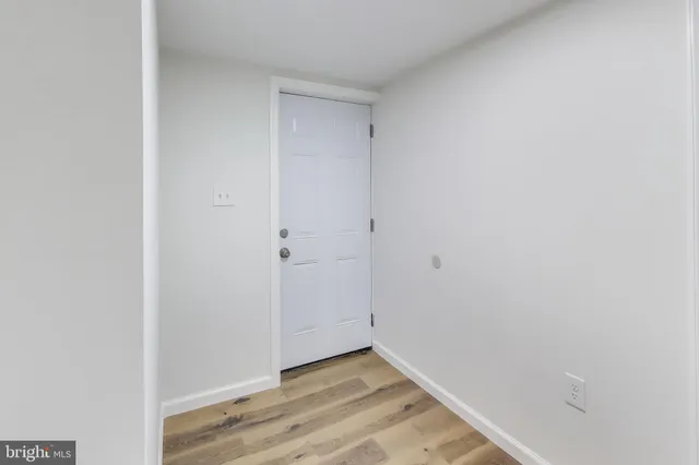 a bathroom with a sink mirror and toilet
