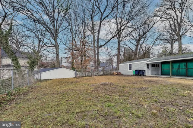 a front view of house with yard and trees