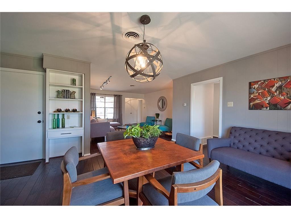 8717 Hackney Lane Dallas, TX 75238 - Photo 6 of 21 Dining space with dark wood-type flooring and hanging lights