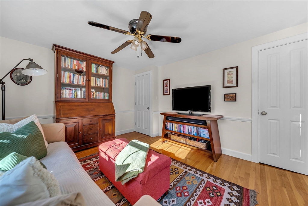 14 Twitchell Street Wellesley, MA 02482 - Photo 16 of 37 a living room with a couch and a flat screen tv