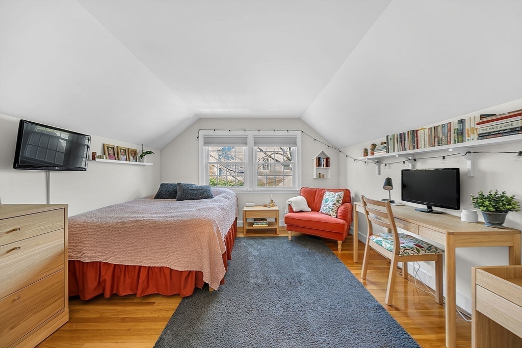 14 Twitchell Street Wellesley, MA 02482 - Photo 17 of 37 a bedroom with furniture and a flat screen tv