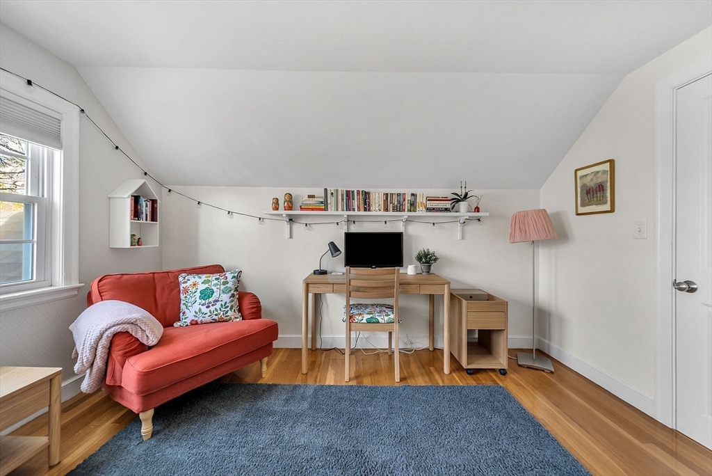 14 Twitchell Street Wellesley, MA 02482 - Photo 22 of 37 a living room with furniture and a flat screen tv