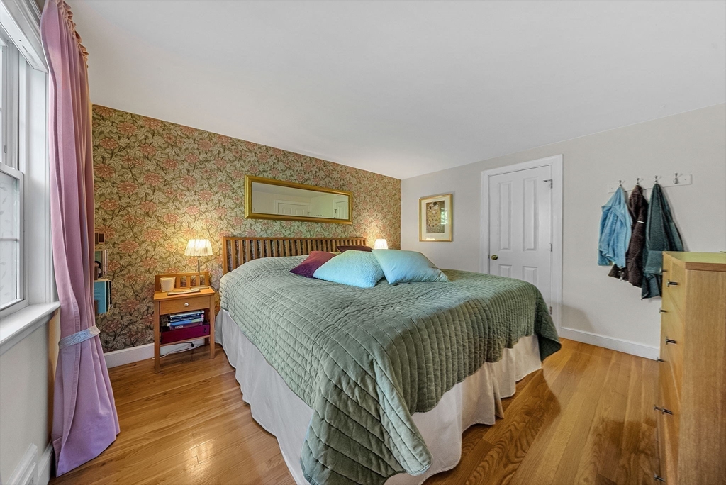 14 Twitchell Street Wellesley, MA 02482 - Photo 24 of 37 a bedroom with a bed and wooden floor