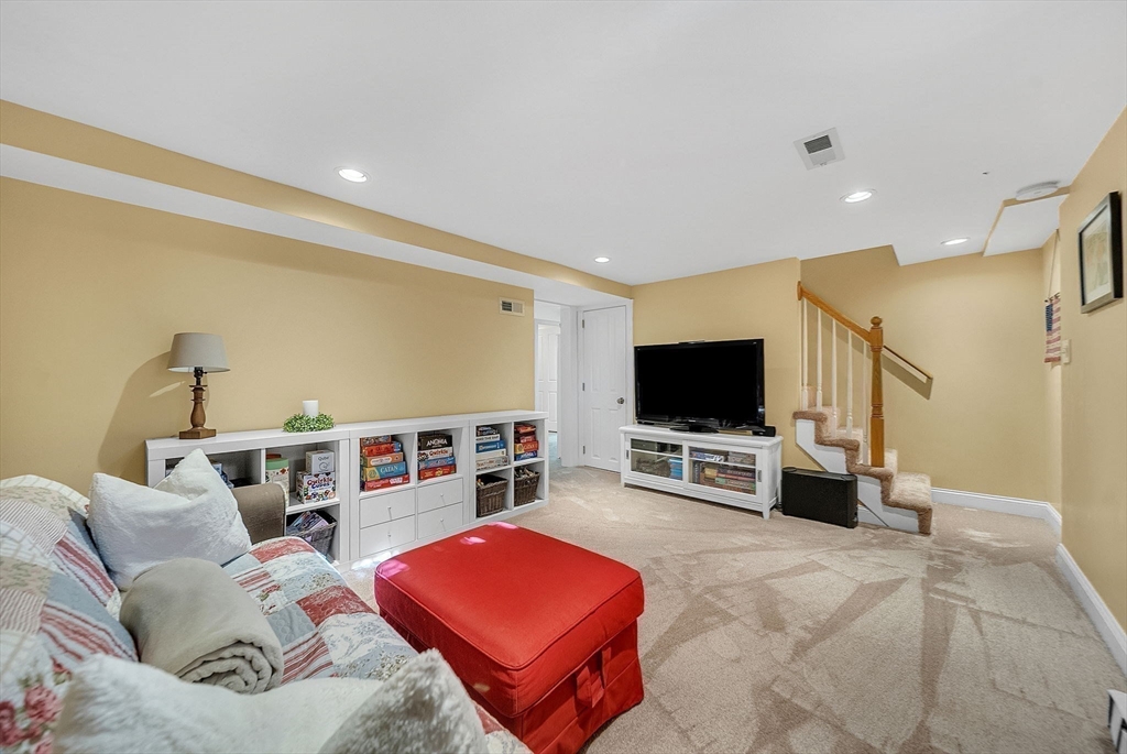 14 Twitchell Street Wellesley, MA 02482 - Photo 26 of 37 a living room with furniture and a flat screen tv