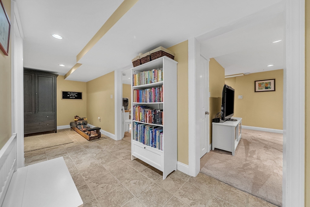 14 Twitchell Street Wellesley, MA 02482 - Photo 28 of 37 a living room with furniture and a book shelf