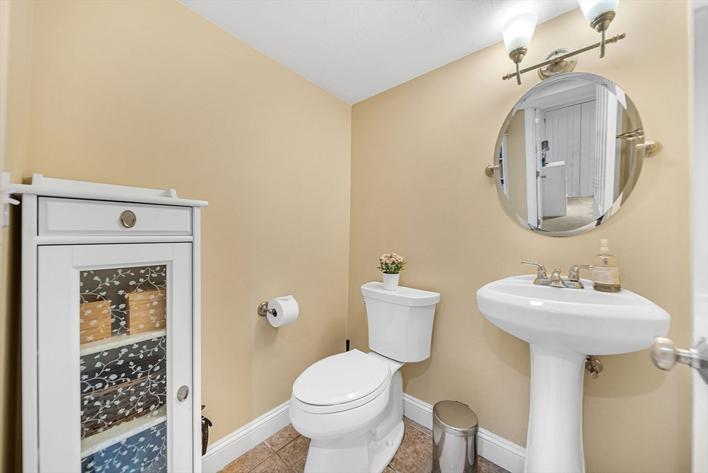 14 Twitchell Street Wellesley, MA 02482 - Photo 31 of 37 a bathroom with a toilet sink and mirror