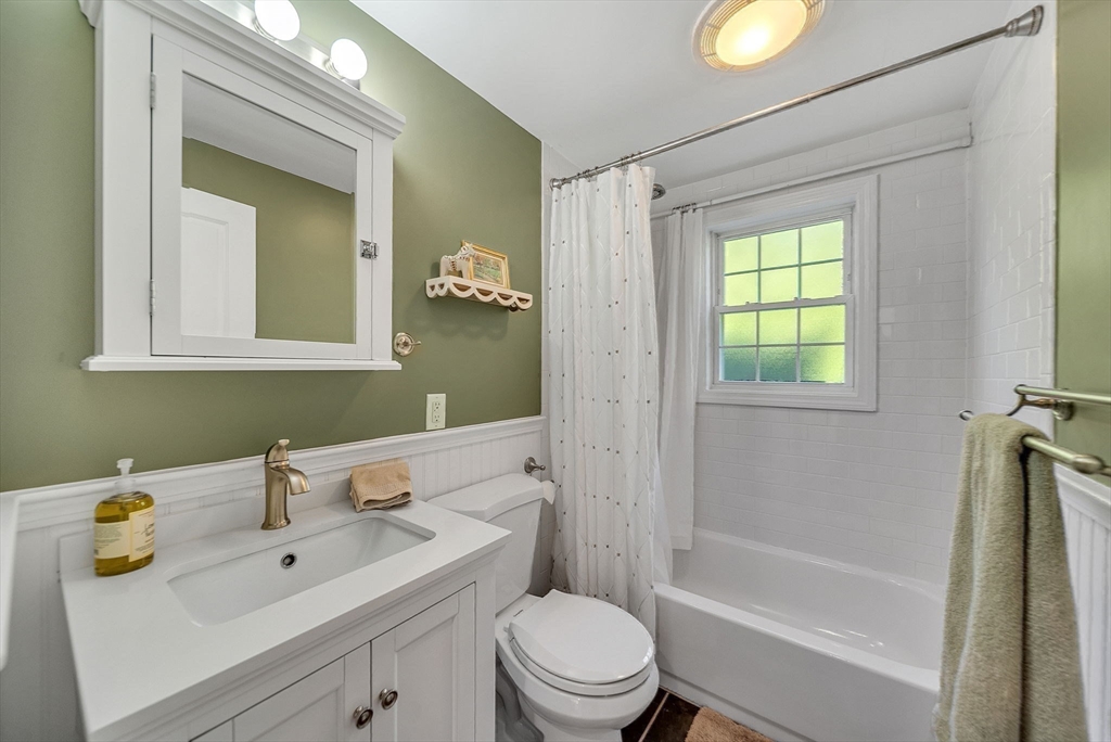 14 Twitchell Street Wellesley, MA 02482 - Photo 33 of 37 a bathroom with a sink mirror toilet and bathtub