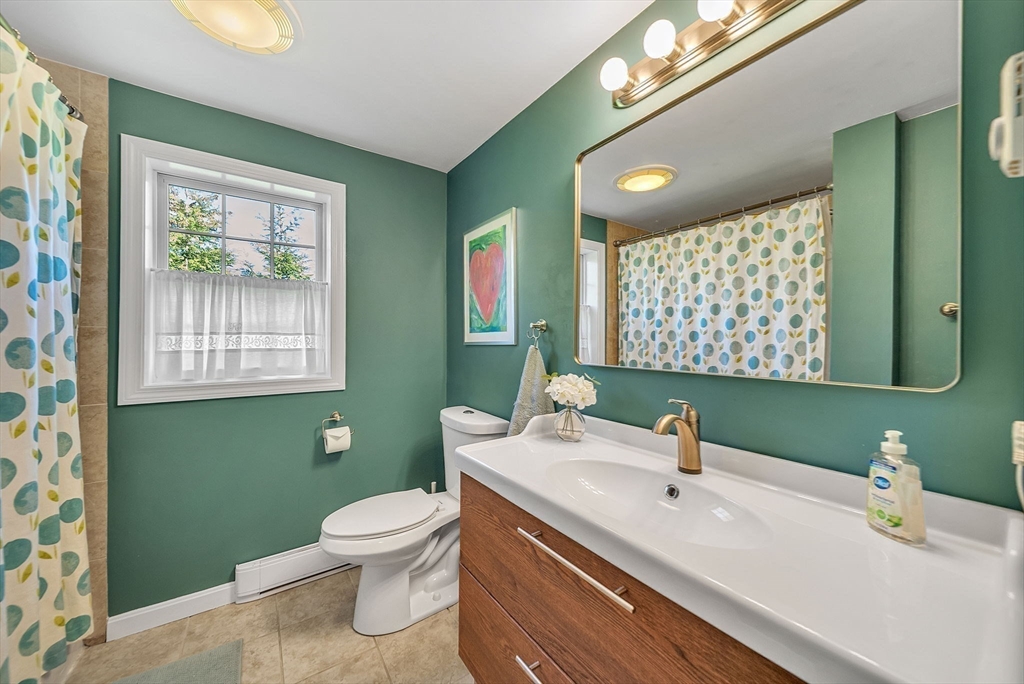 14 Twitchell Street Wellesley, MA 02482 - Photo 34 of 37 a bathroom with a toilet sink and green