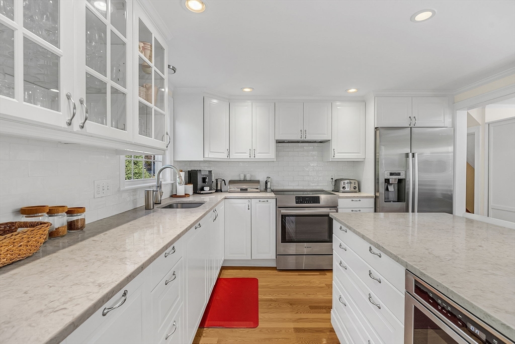 14 Twitchell Street Wellesley, MA 02482 - Photo 6 of 37 a kitchen with stainless steel appliances granite countertop a refrigerator sink and stove