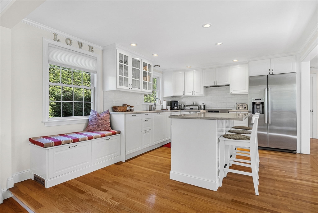14 Twitchell Street Wellesley, MA 02482 - Photo 7 of 37 a kitchen with stainless steel appliances granite countertop a refrigerator sink and cabinets