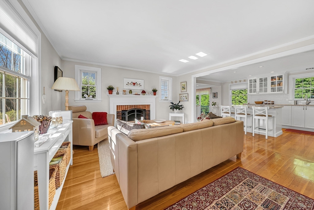 14 Twitchell Street Wellesley, MA 02482 - Photo 10 of 37 a living room with furniture a fireplace and a table