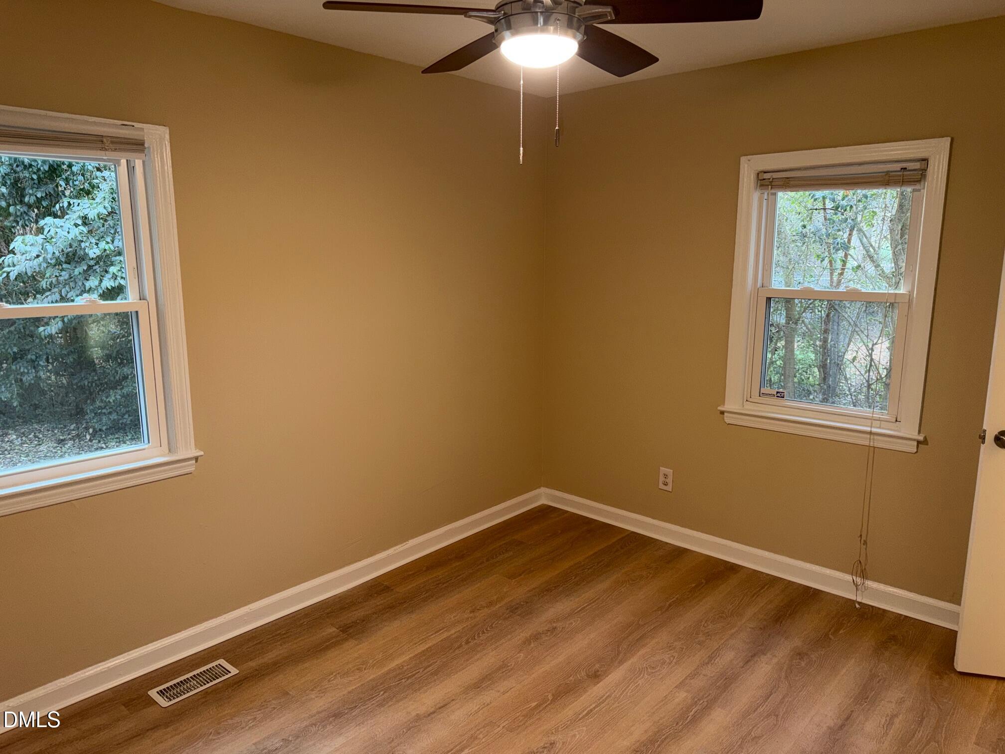 3117 Tryon Road Raleigh, NC 27603 - Photo 12 of 21 a room with a window and ceiling fan