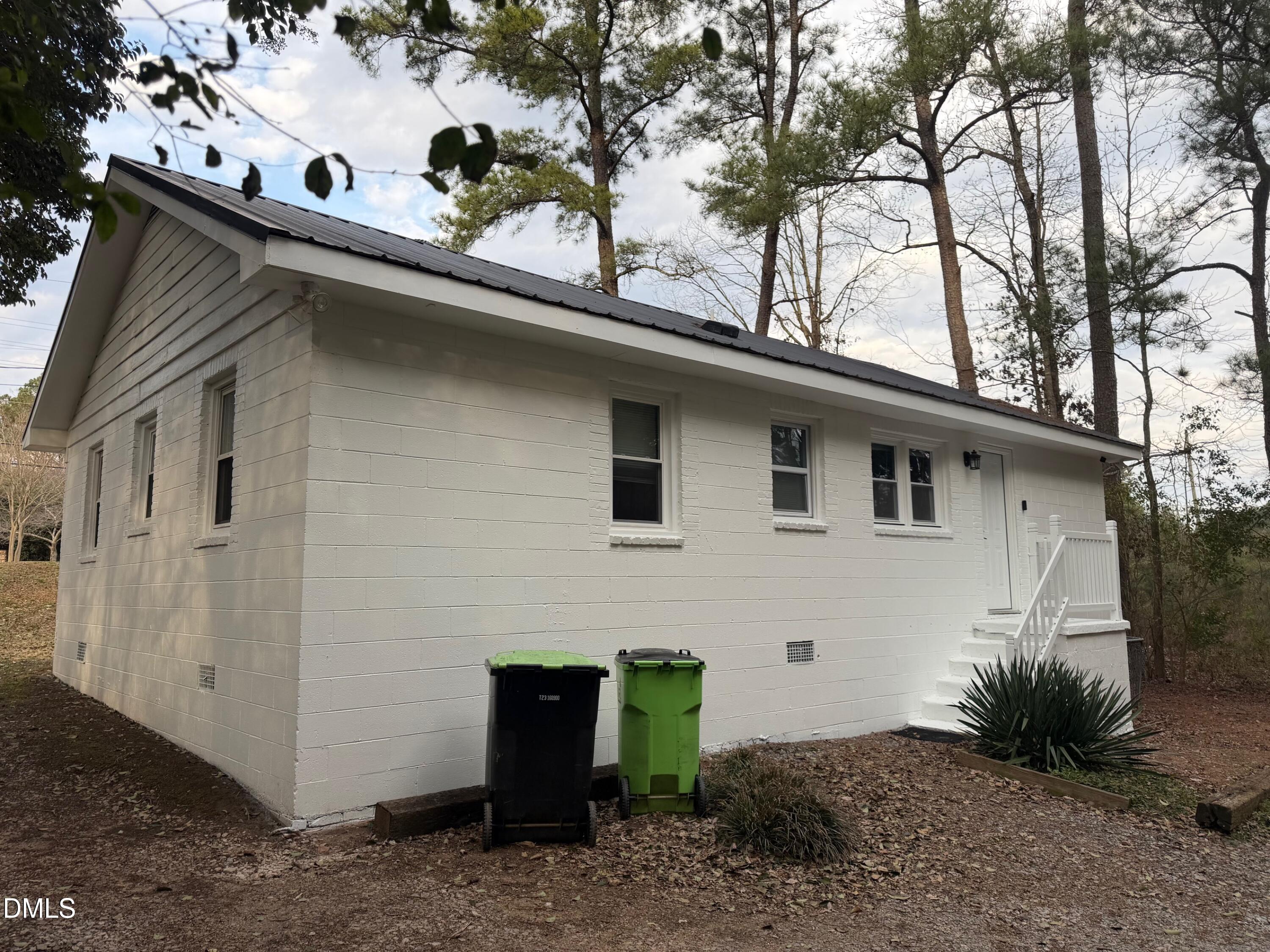 3117 Tryon Road Raleigh, NC 27603 - Photo 3 of 21 a front view of a house with garden
