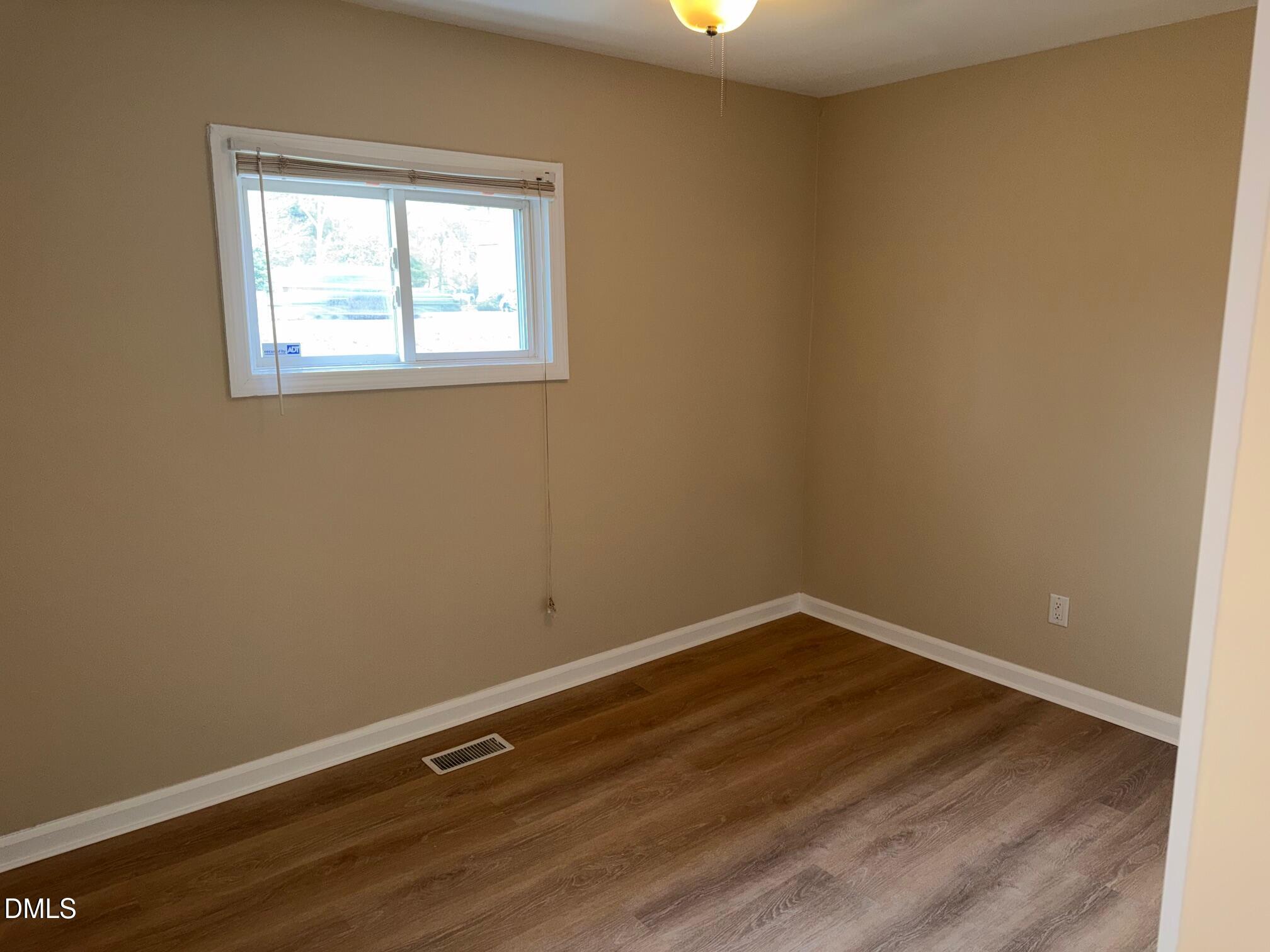 3117 Tryon Road Raleigh, NC 27603 - Photo 10 of 21 an empty room with a window