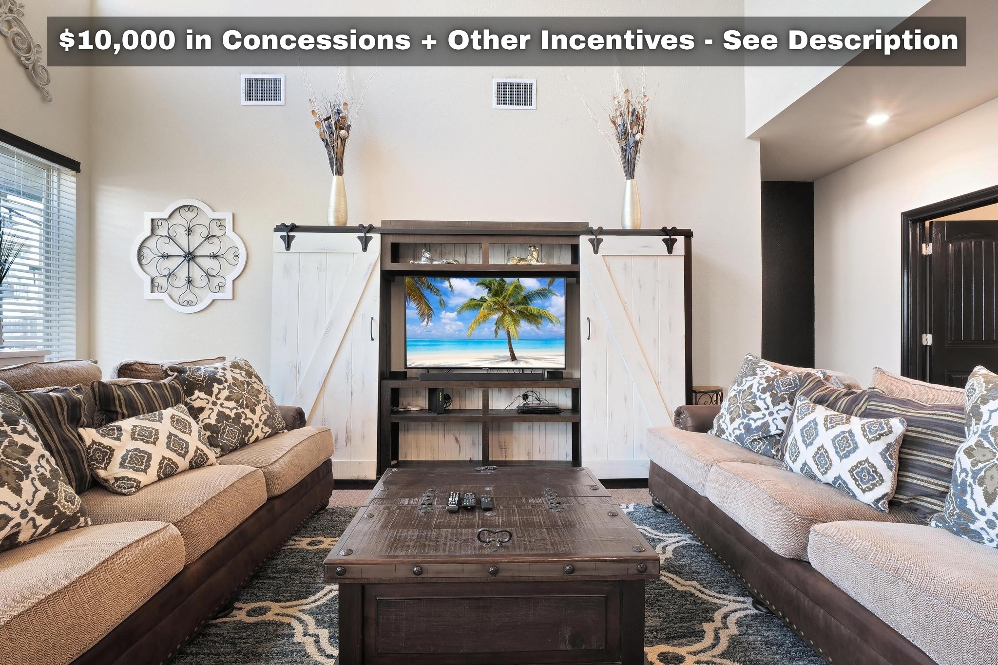 a living room with furniture and a table