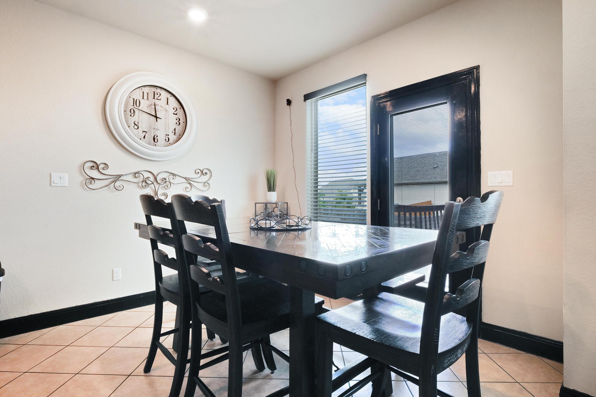 205 Windom Way Georgetown, TX 78626 - Photo 8 of 28 a view of a dining room and a table and chairs
