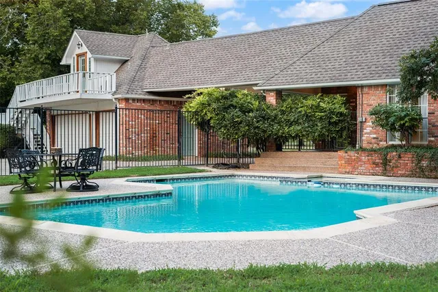 a view of a house with a swimming pool