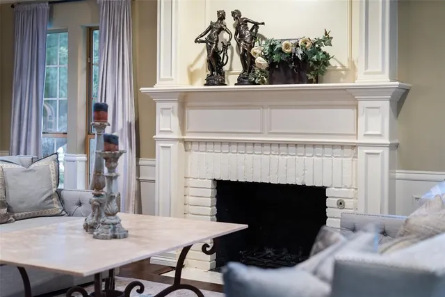 a view of a livingroom with furniture and a fireplace