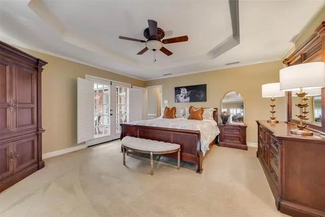 a bed room with a bed and a chandelier