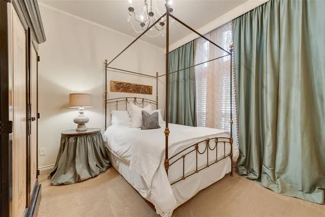 a bedroom with a bed and a night stand