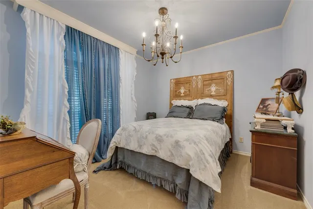 a bedroom with a bed wooden floor and window