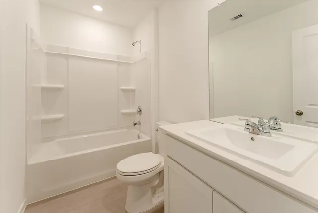 a bathroom with a sink a toilet and bathtub