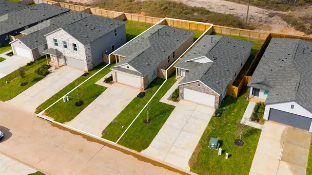 an aerial view of a house with a garden and plants