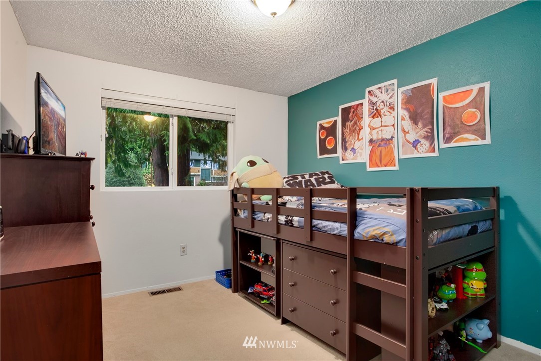 10727 126th Avenue Northeast Kirkland, WA 98033 - Photo 17 of 40 a view of a room with window and furniture