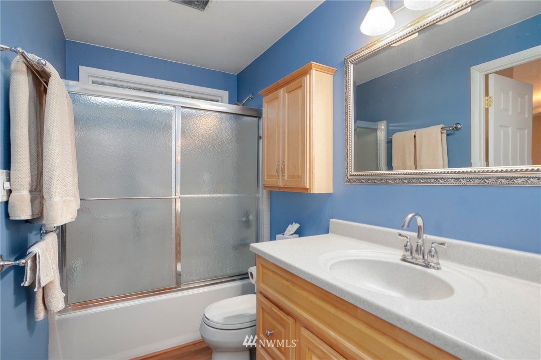 10727 126th Avenue Northeast Kirkland, WA 98033 - Photo 19 of 40 a bathroom with a sink toilet and shower