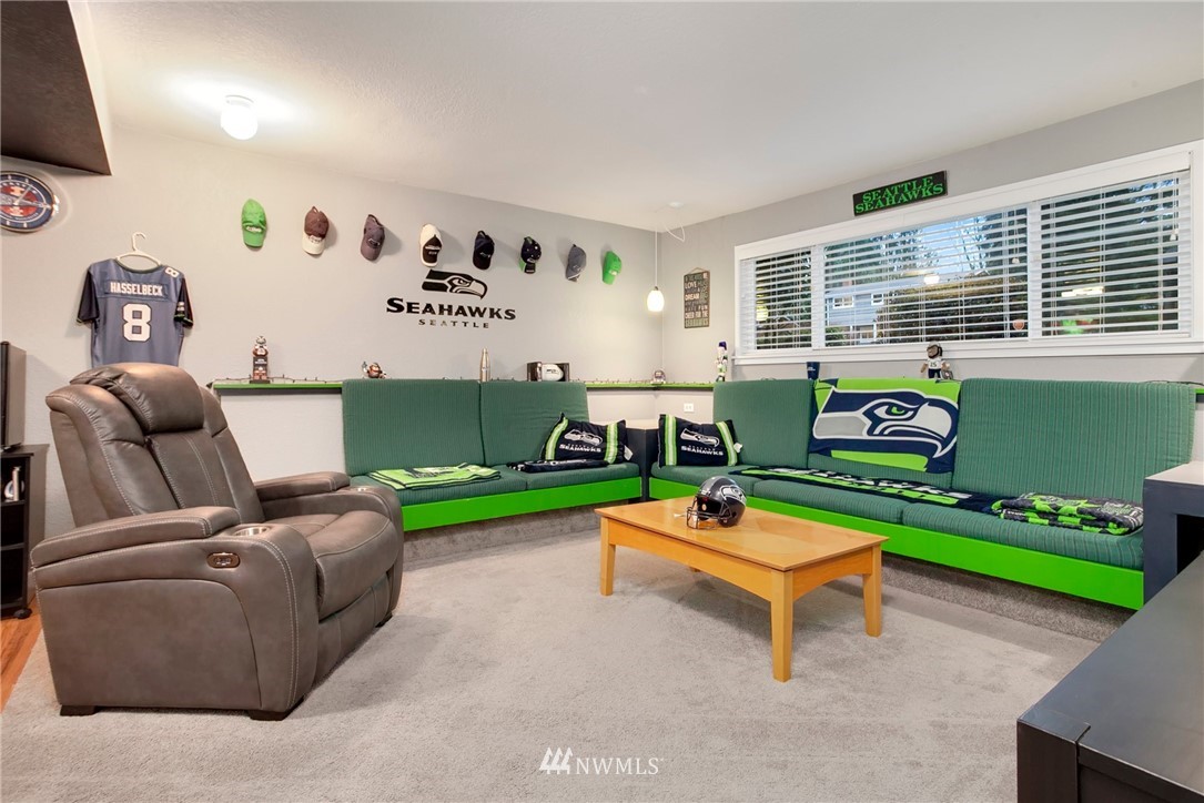 10727 126th Avenue Northeast Kirkland, WA 98033 - Photo 20 of 40 a room with furniture and a wooden floor