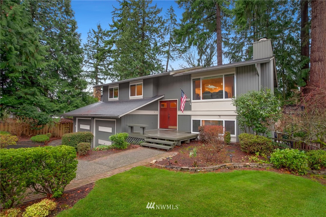10727 126th Avenue Northeast Kirkland, WA 98033 - Photo 2 of 40 a front view of a house with a yard and green space