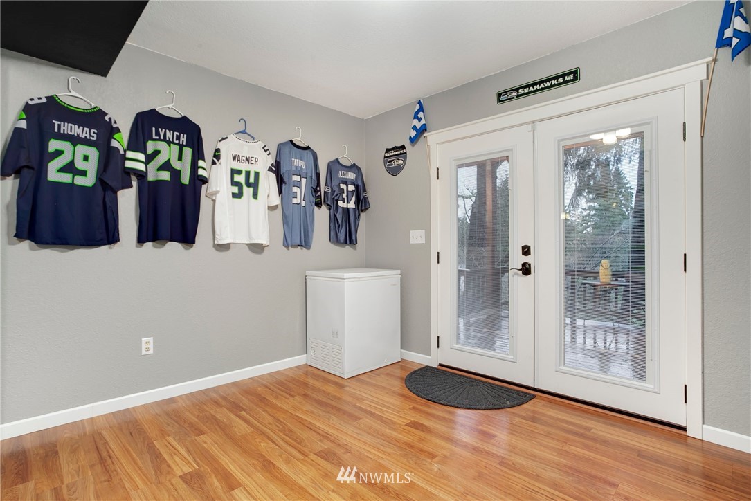 10727 126th Avenue Northeast Kirkland, WA 98033 - Photo 23 of 40 a view of a room with wooden floor and closet