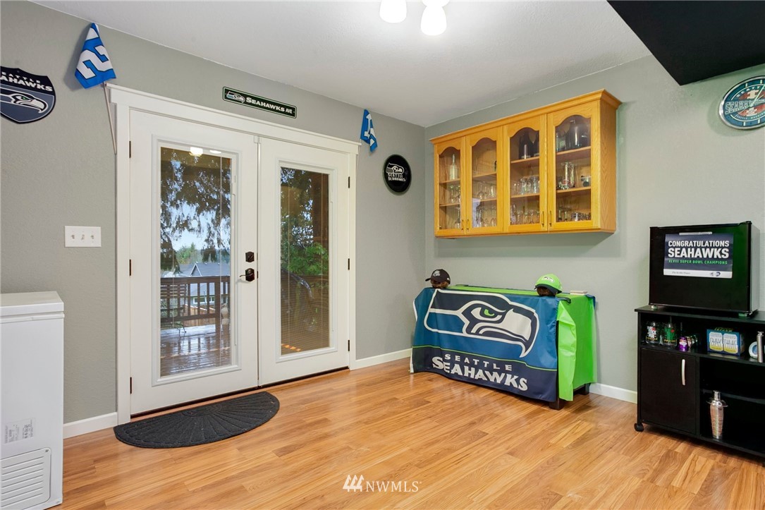 10727 126th Avenue Northeast Kirkland, WA 98033 - Photo 24 of 40 a view of an entryway with wooden floor and windows