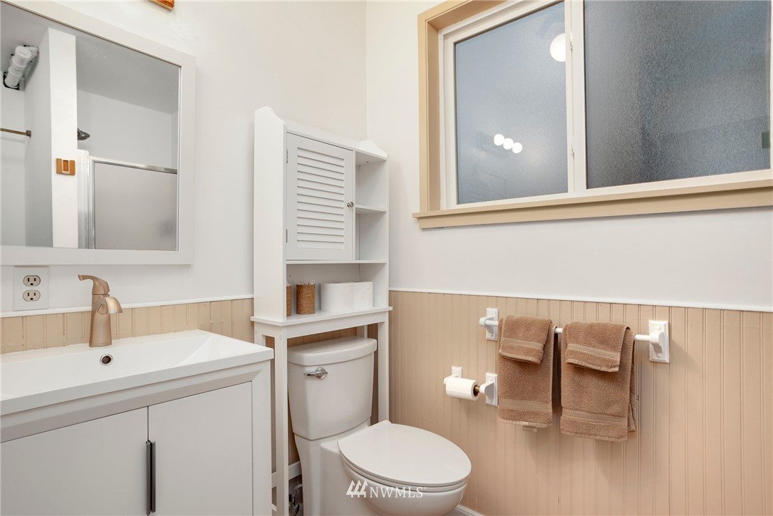 10727 126th Avenue Northeast Kirkland, WA 98033 - Photo 25 of 40 a bathroom with a sink a toilet and mirror