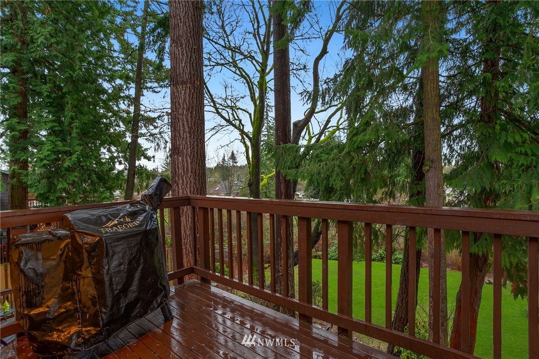 10727 126th Avenue Northeast Kirkland, WA 98033 - Photo 27 of 40 a view of balcony with wooden floor and fence
