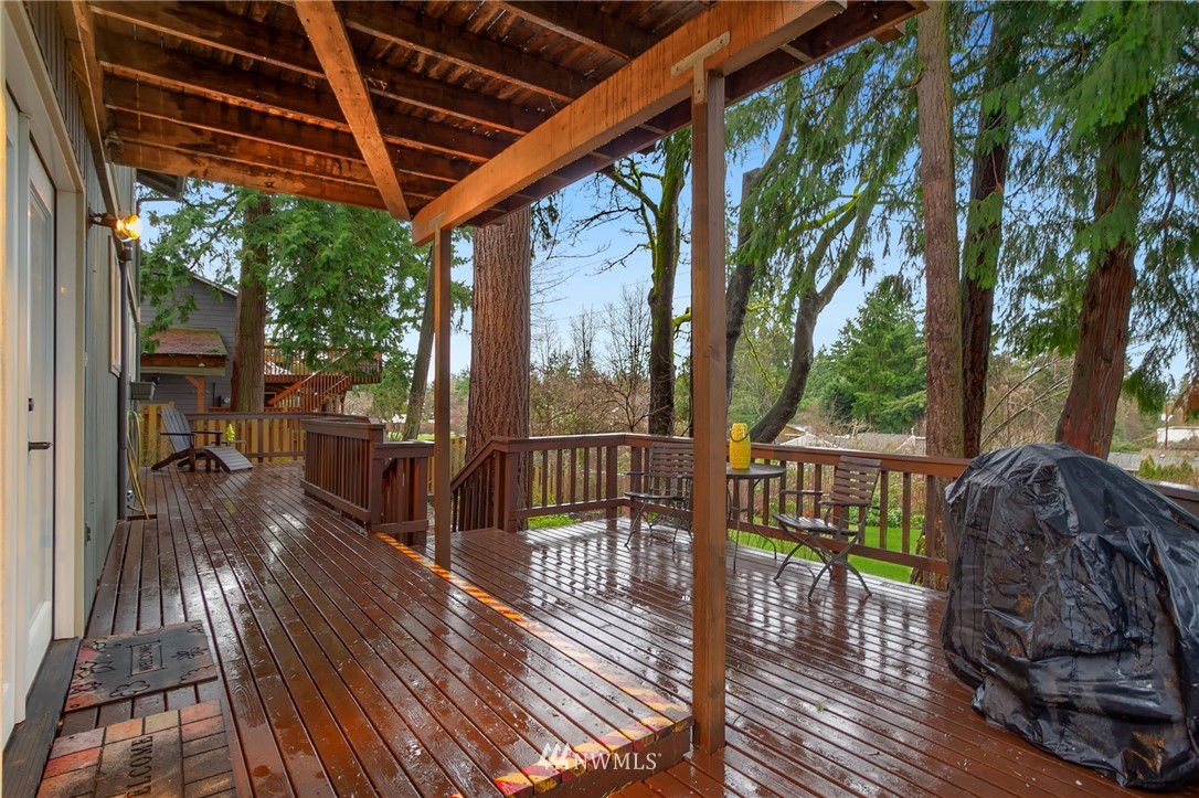 10727 126th Avenue Northeast Kirkland, WA 98033 - Photo 30 of 40 a view of porch with wooden floor and outdoor seating