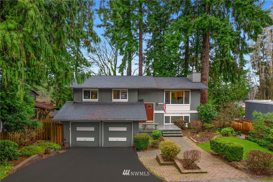 10727 126th Avenue Northeast Kirkland, WA 98033 - Photo 35 of 40 a front view of a house with a garden