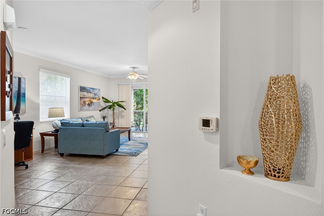 8251 Pathfinder Loop, Unit 621 Fort Myers, FL 33919 - Photo 2 of 30 a living room with furniture and a window