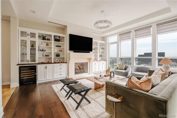 a living room with fireplace furniture and a flat screen tv