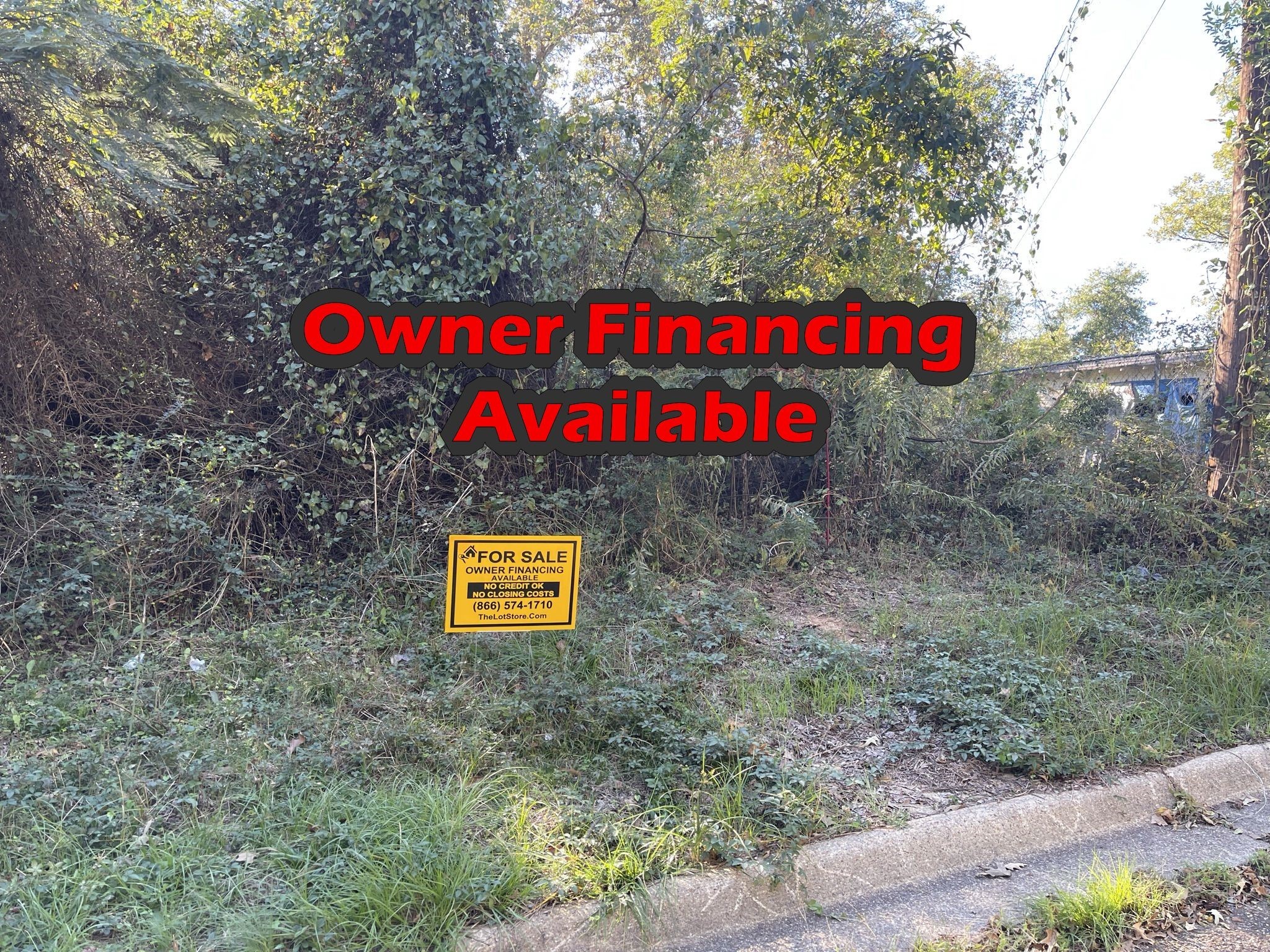 a street sign that is sitting on a brick wall