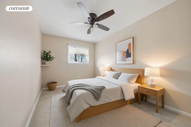 a bedroom with a bed and window