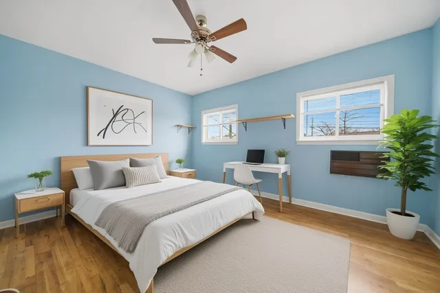 a bedroom with a bed and window