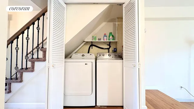 a view of hallway with washer and dryer