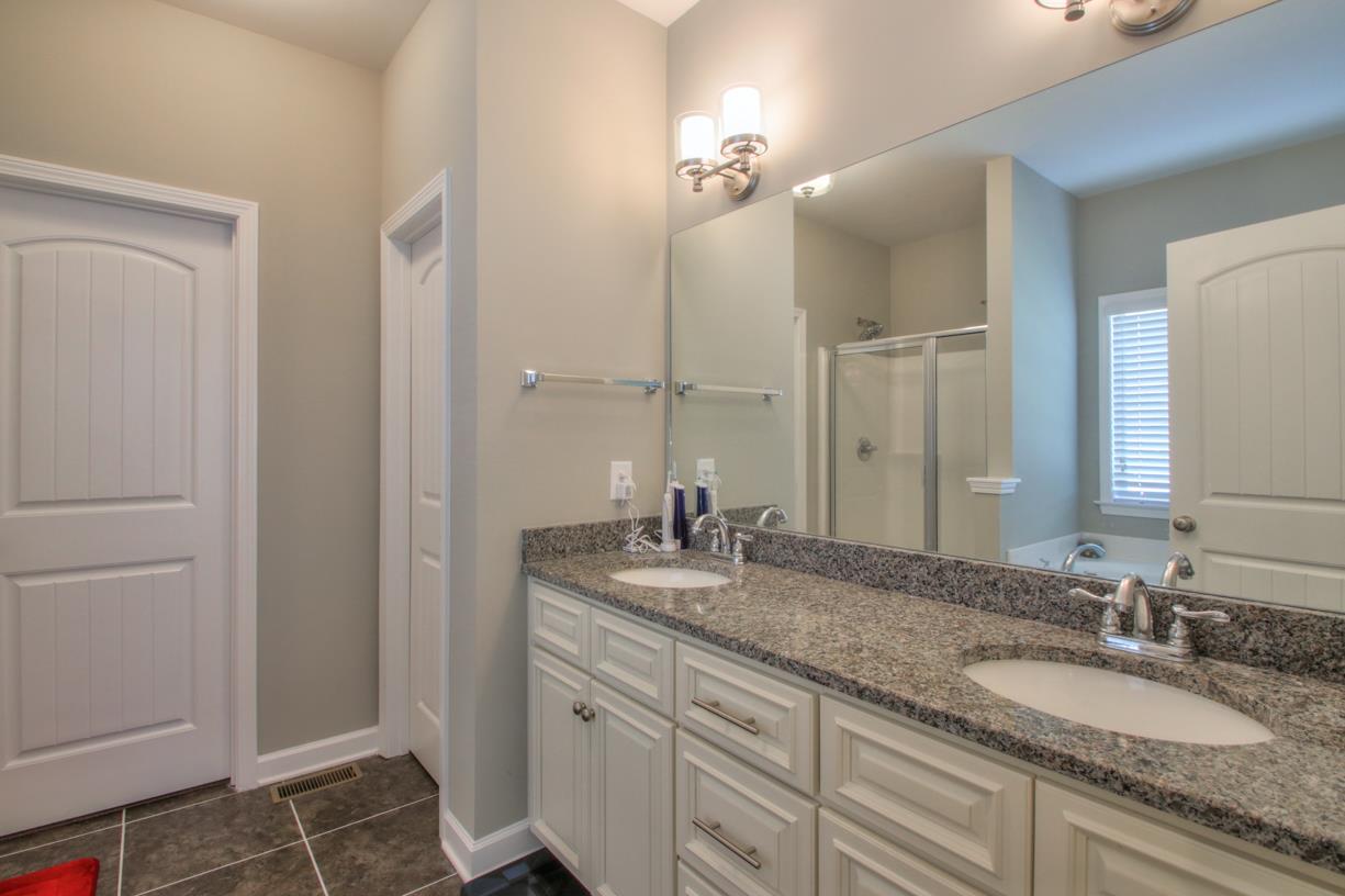8001 Ragusa Circle Spring Hill, TN 37174 - Photo 14 of 30 Master bathroom with a separate shower and tub! Door on the left is a walk in closet! Door on right is separate water closet!